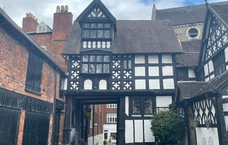 Timber-framed Tudor house over gateway, Council House Court, Shrewsbury, Shropshire, England, August 2025