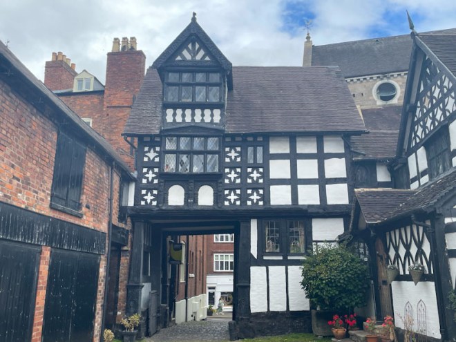 Timber-framed Tudor house over gateway, Council House Court, Shrewsbury, Shropshire, England, August 2025