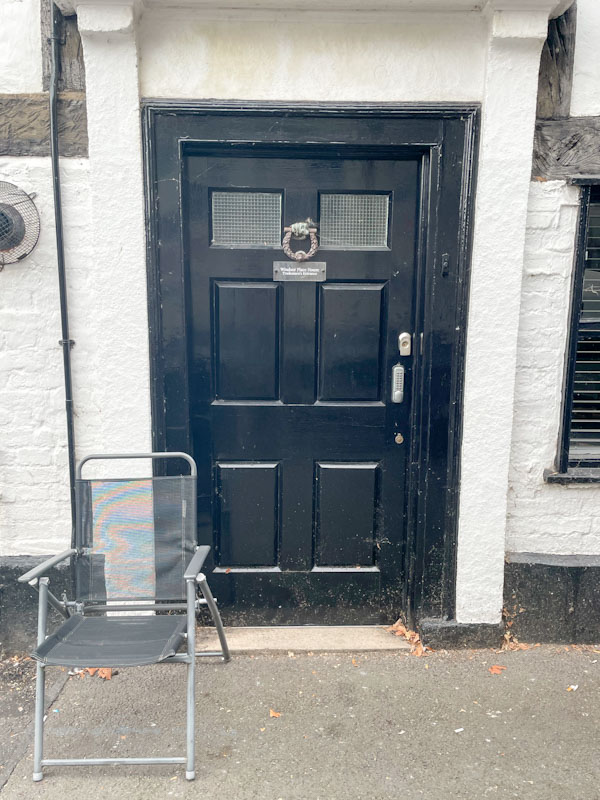 Black door and chair, Windsor Place, Shrewsbury, Shropshire, August 2026