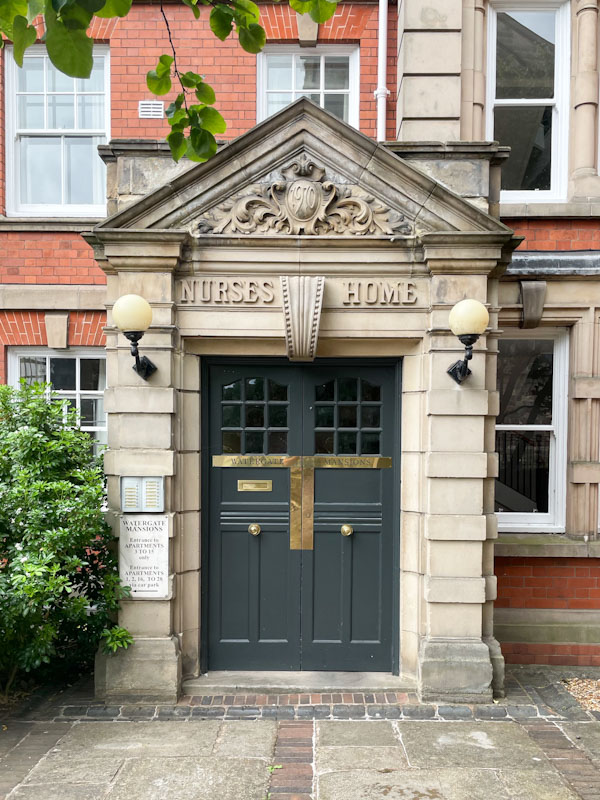 Grand doorway and door to the Nurses Home (1910), St Mary's Court, Shrewsbury, Shropshire, August 2026