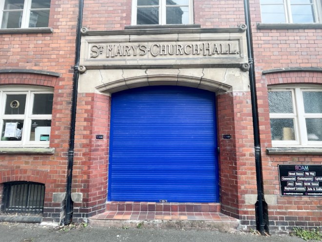 Blue gate door to St Mary's Church Hall, St Mary's Court, Shrewsbury, Shropshire, August 2026