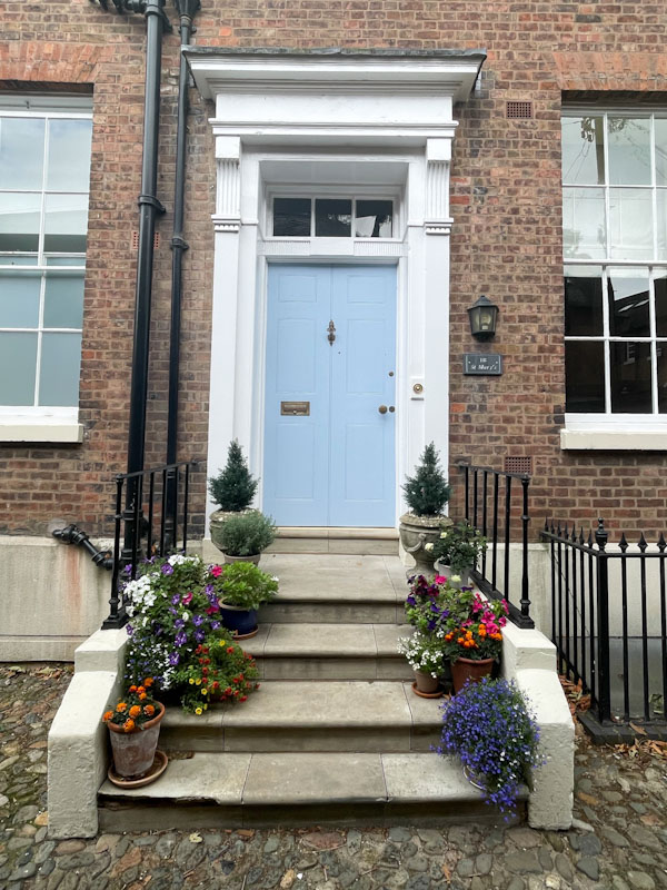 Blue door, steps and plant pots, St Mary's Court, Shrewsbury, Shropshire, August 2026