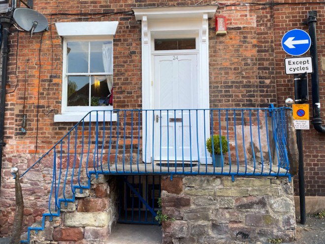 Steps leading to a white front door, Meadow Place, Shrewsbury, Shropshire, England, April 2026