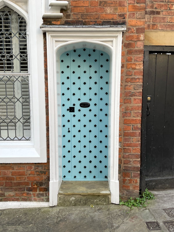 Studded light blue door, School Gardens, Shrewsbury, Shropshire, England, April 2025