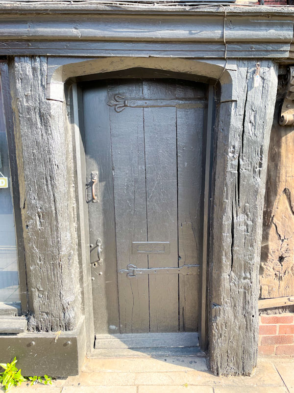 Double handled panelled door and timber door frame, Frankwell, Shrewsbury, Shropshire, England, April 2025