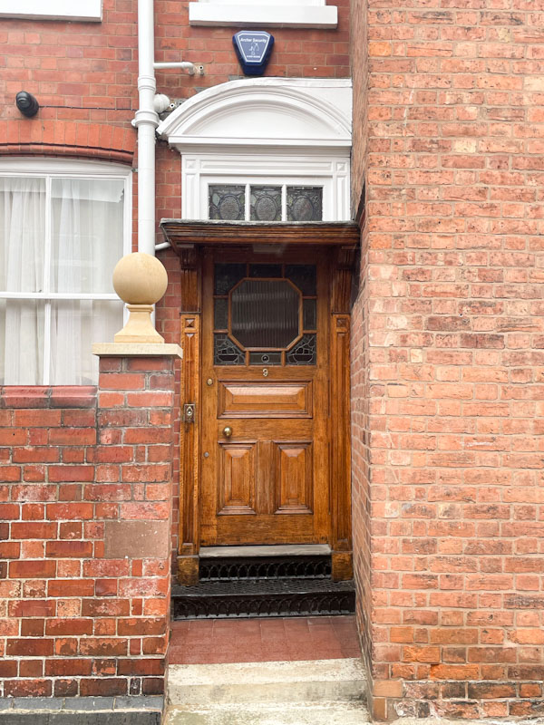 Stripped and varnished door and awning, Belmont, Shrewsbury, Shropshire, England, August 2025