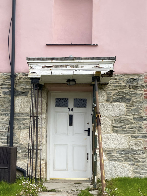 White door with rickety awning, Charlestown, Cornwall, October 2026