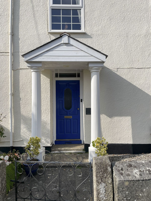 Blue door with portico, Quay Street, Lostwithiel, Cornwall, October 2026