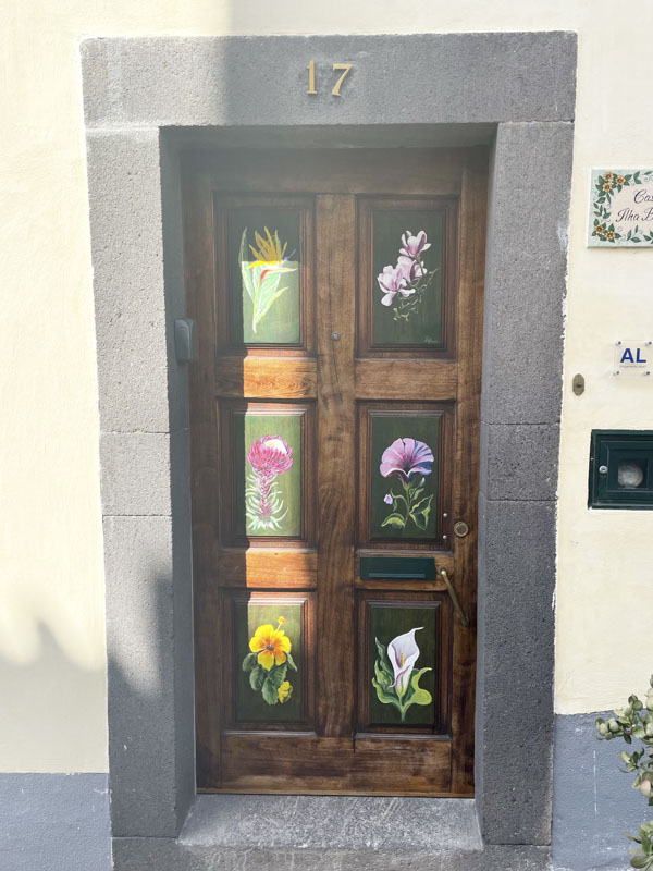 Door with flower-decorated panels, Travessa de Joao Ribeiro, Funchal, Madeira, September 2025