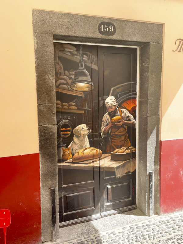 Door with a stunning bakery scene, Rua de Santa Maria, Funchal, Madeira, September 2025