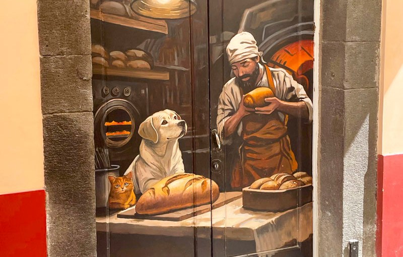 Door with a stunning bakery scene, Rua de Santa Maria, Funchal, Madeira, September 2025