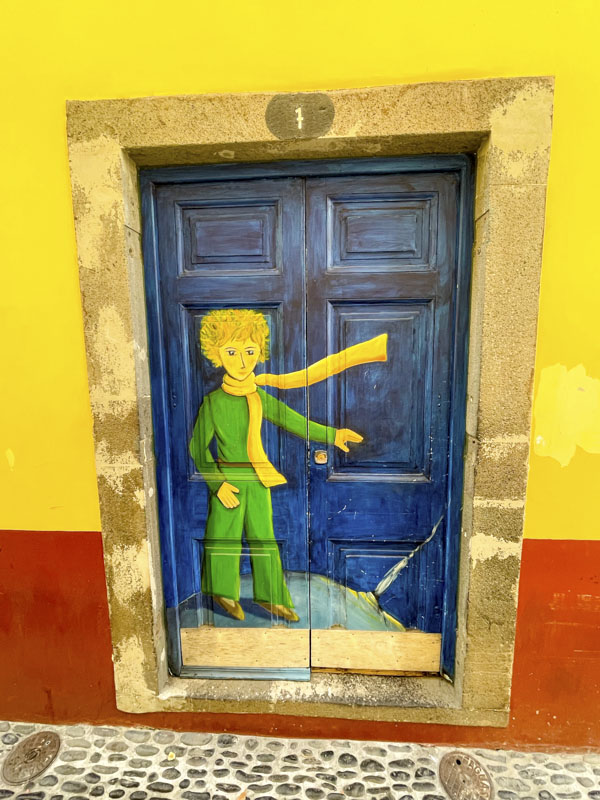 Door with a painted character, Rua de Santa Maria, Funchal, Madeira, September 2025