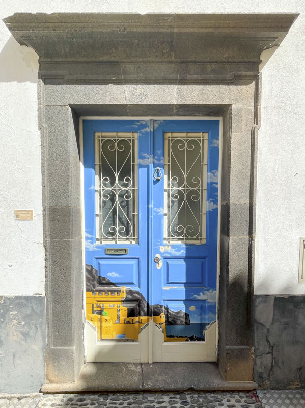 Door with a painted cliff scene, Rua de Santa Maria, Funchal, Madeira, September 2025