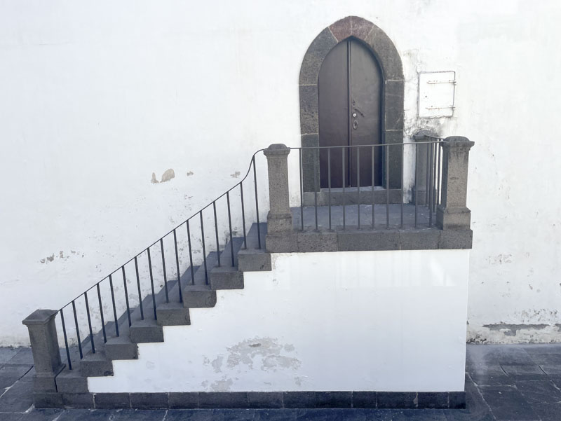 Steps and door to Funchal Cathedral, Funchal, Madeira, Portugal, September 2025