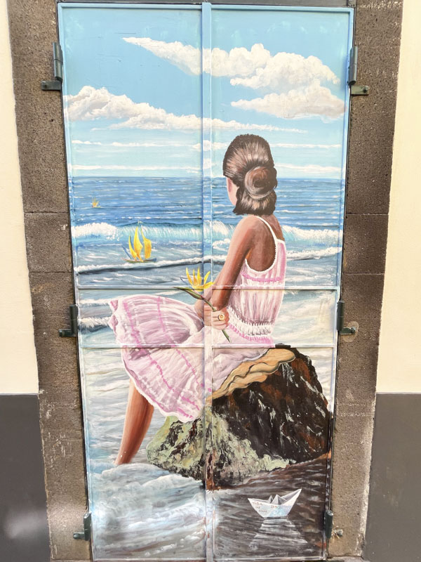 Door with a wistful beach scene, Rua de SantaMaria, Funchal, Madeira, Portugal, September 2025